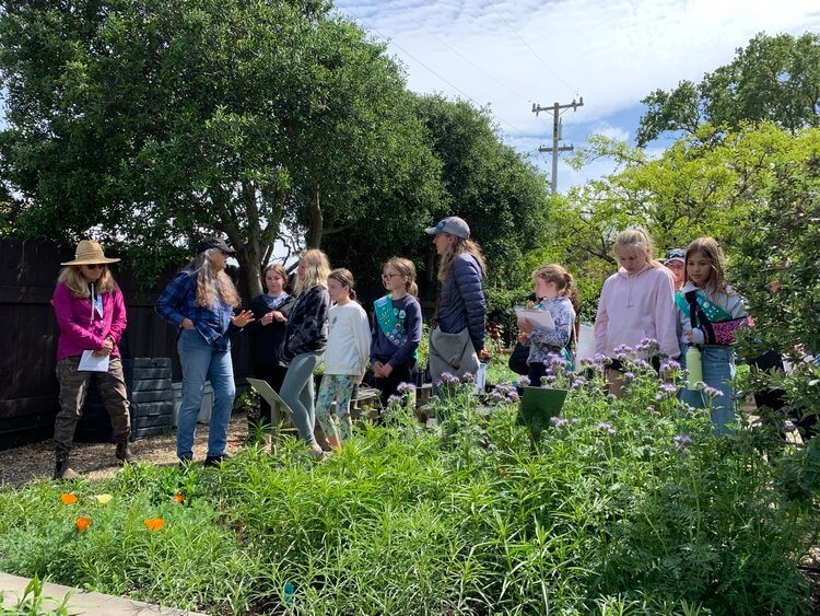 Local Girl Scout troops touring HGH garden with Charlotte